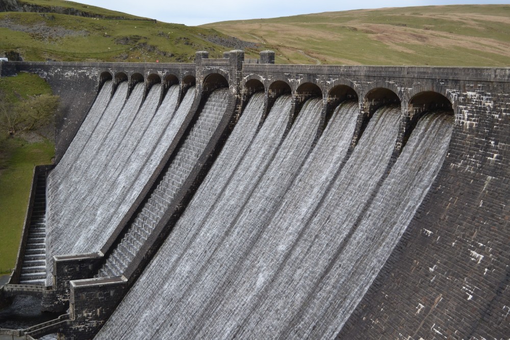 A dam with water running down - Claerwen Dam